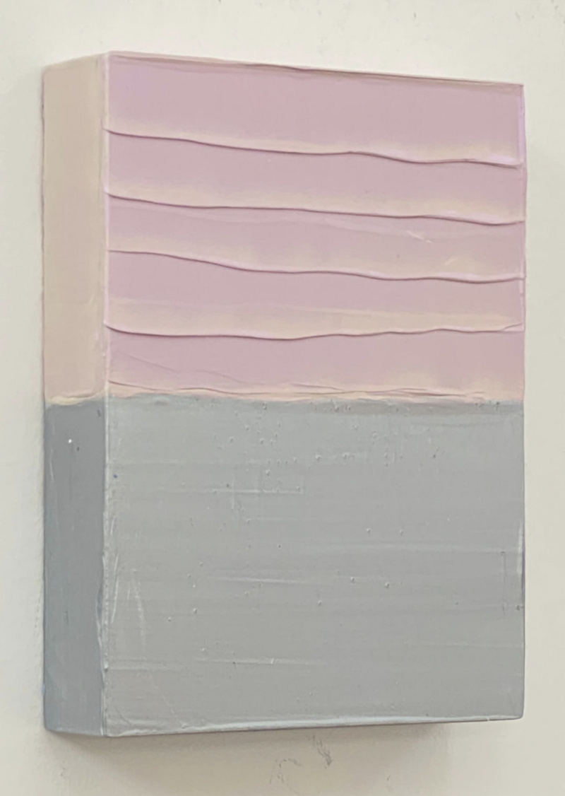 This image shows a contemporary painting by McCain McMurray titled "20.49." The artwork consists of layered horizontal bands of pale pink at the top half, with each band having a wavy edge, creating a sense of gentle movement. The bottom half displays a solid block of muted grey, and the painting has a textured surface, evident in the visible brushstrokes and raised areas. The side view captures the depth of the canvas and reveals the natural wooden stretcher bar, adding an organic touch to the otherwise pastel color scheme. The painting's dimensions are 8x6x1.5 inches, and it was created in 2022